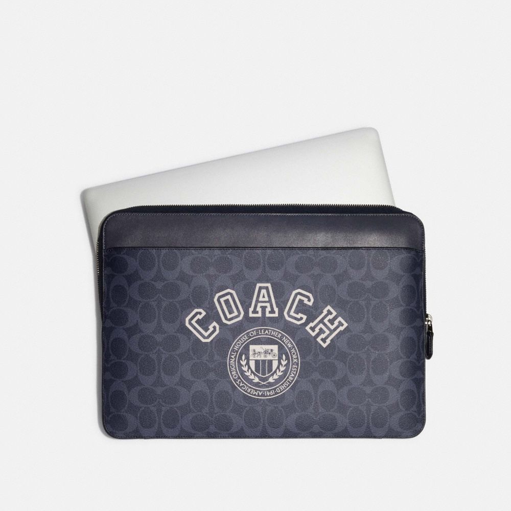 Shop Coach Laptop Sleeve In Signature Canvas With Coach Varsity