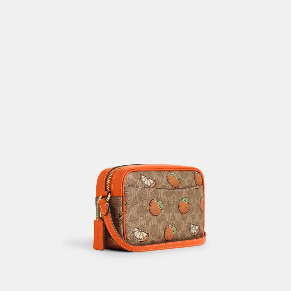 COACH®,Mini Jamie Camera Bag In Signature Canvas With Orange Print,Canvas,Camera Bag,Metal,Piping,Logo,Color Block,Gold Me...,Brown,Angle View