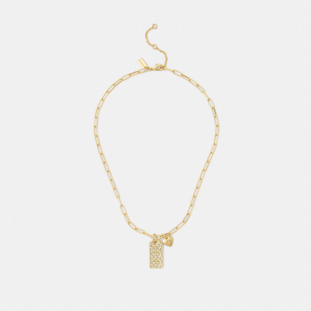 Shop Coach Cutout Signature Hangtag And Heart Necklace In Gold