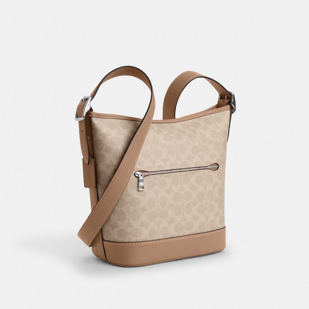 COACH®,Jude Duffle Bag In Signature Canvas,Beige,Angle View