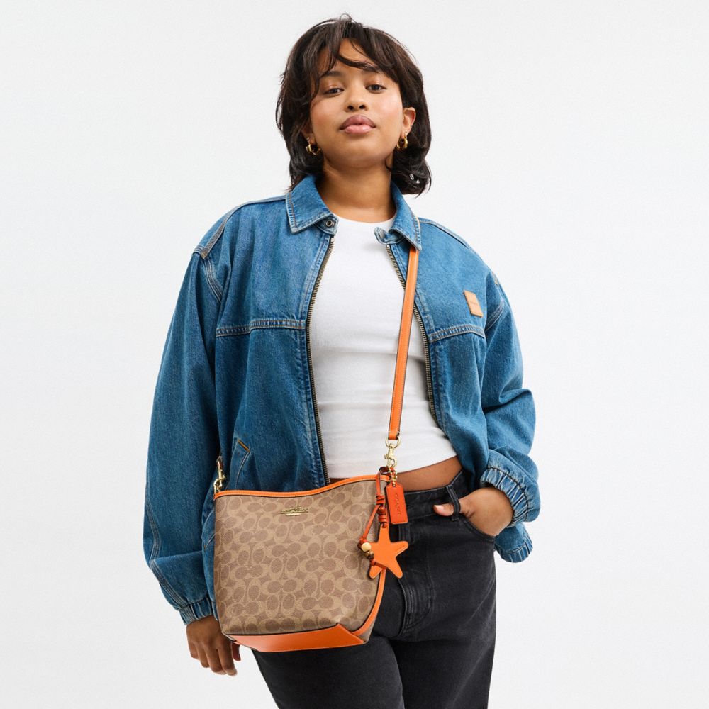 COACH®,City Bucket Bag In Signature Canvas With Star Charm,