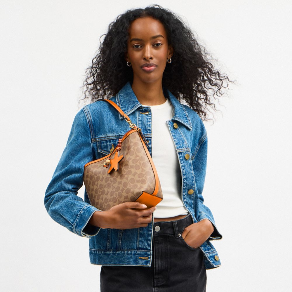 COACH®,City Bucket Bag In Signature Canvas With Star Charm,,Detail View