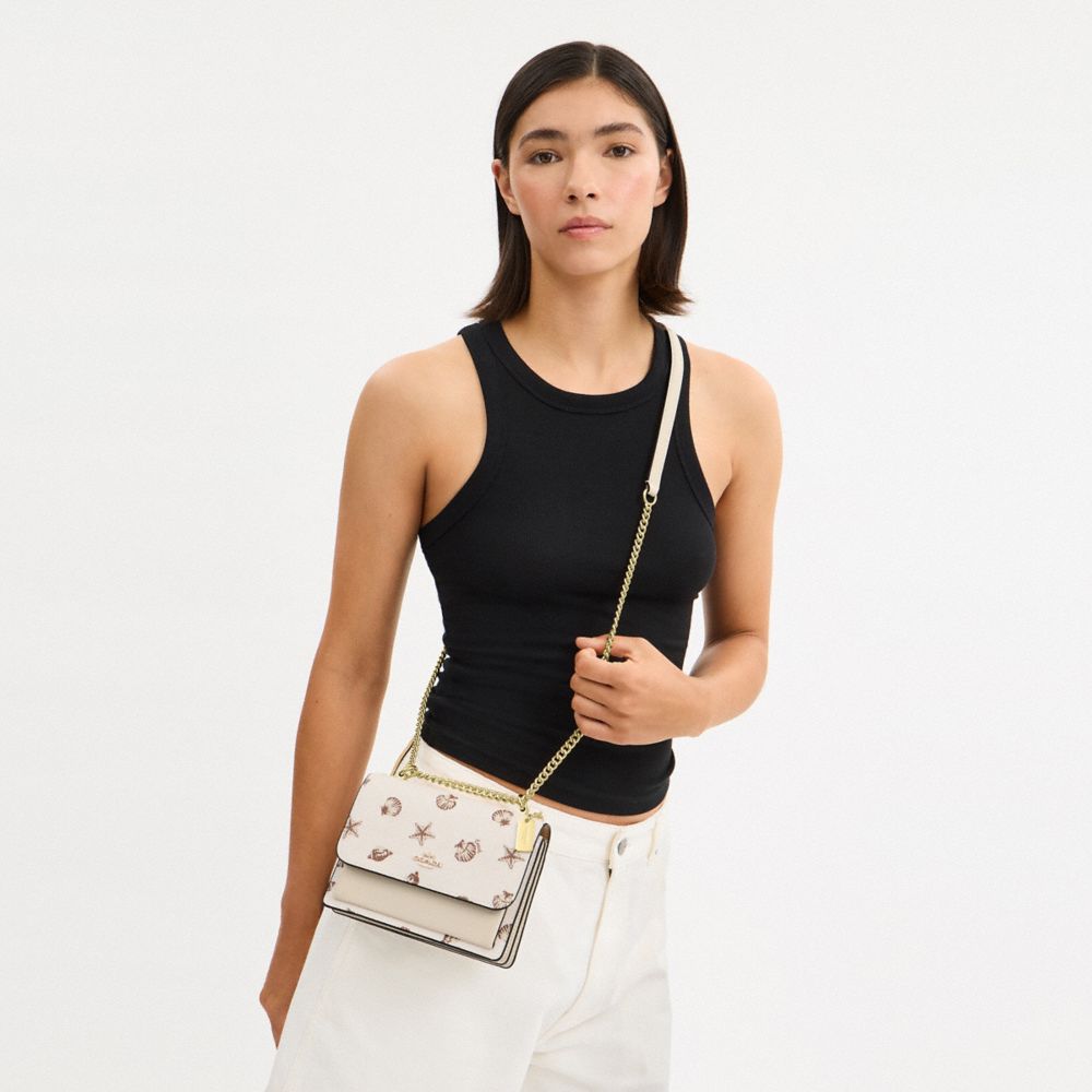 COACH®,Mini Klare Crossbody Bag With Shell Print,