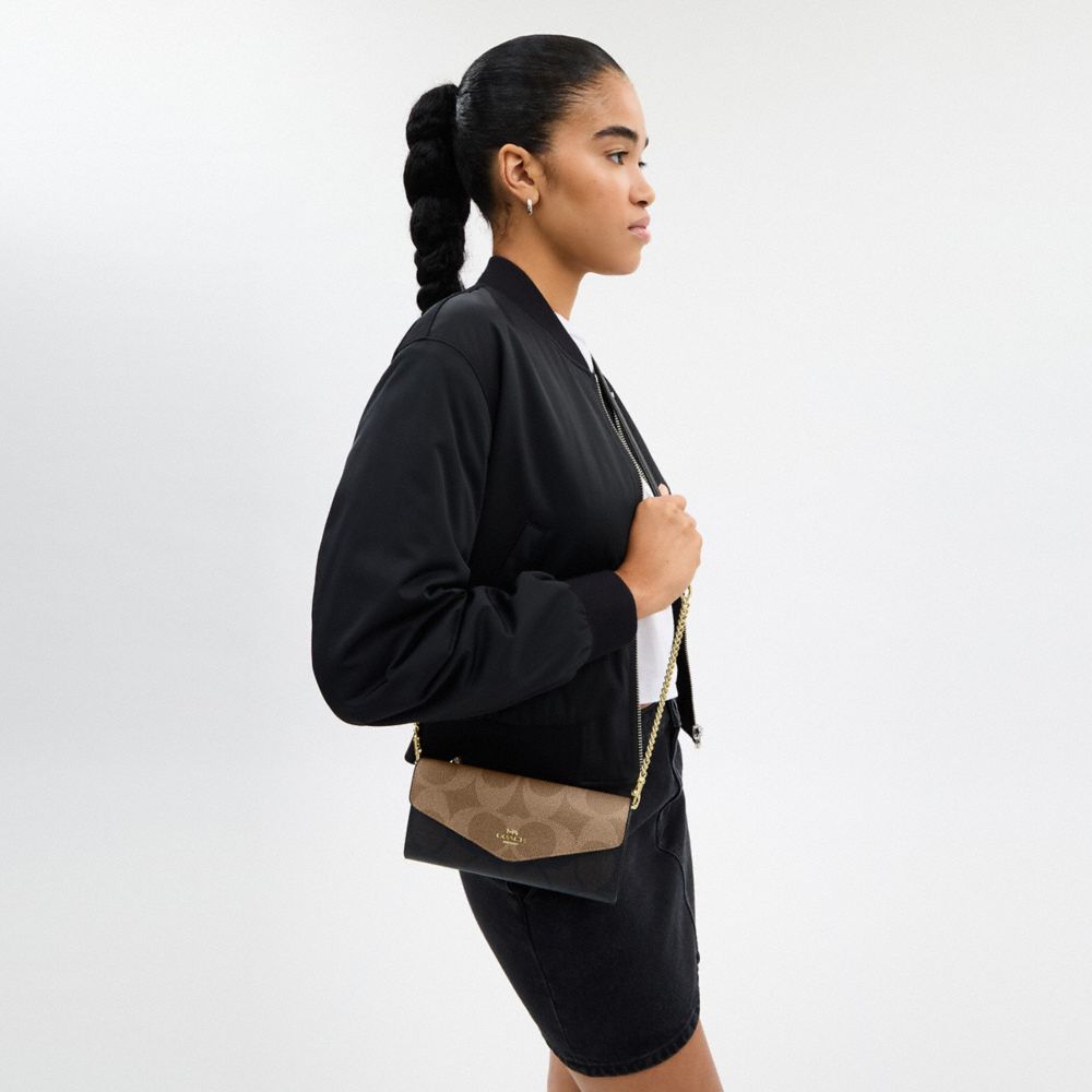 COACH®,Klare Wallet With Chain In Blocked Signature Canvas,