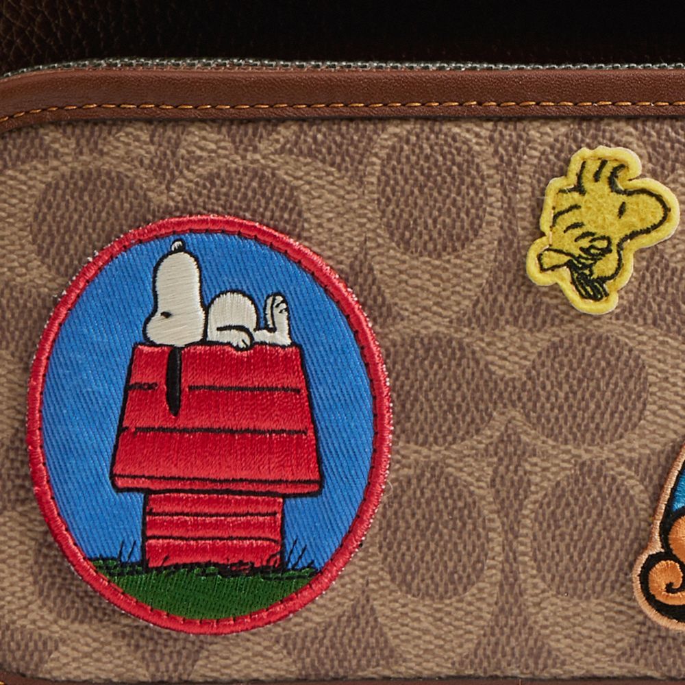 COACH®,Coach X Peanuts Sullivan Flap Crossbody Bag In Signature Canvas With Patches,,Closer View