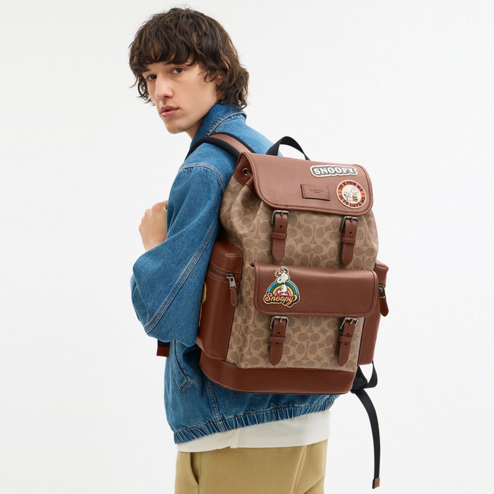 COACH®,Coach X Peanuts Sprint Backpack In Signature Canvas With Patches,,Detail View