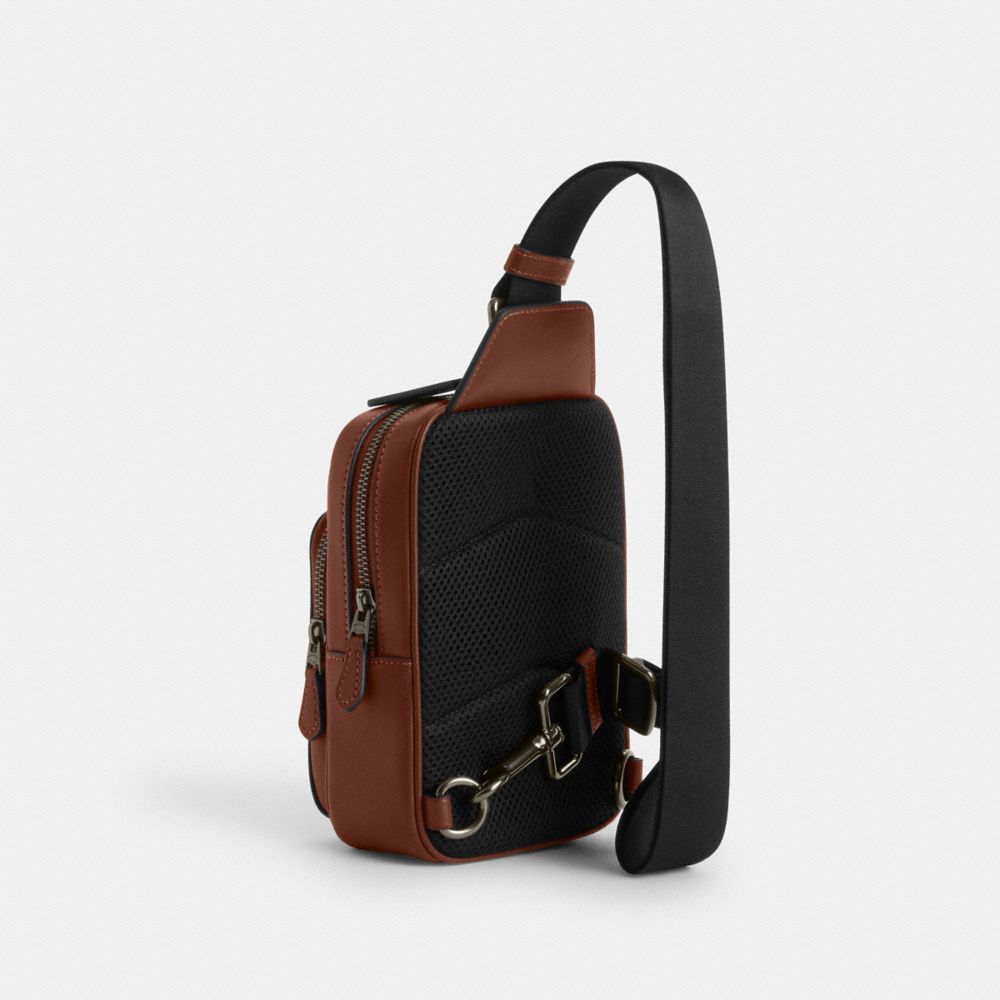COACH®,Coach X Peanuts Racer Sling Pack In Signature Canvas With Snoopy Print,,Angle View