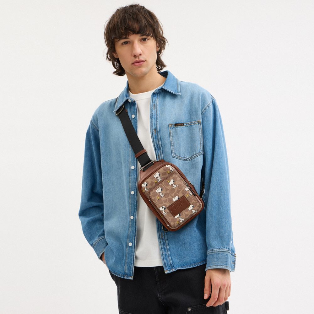 COACH®,Coach X Peanuts Racer Sling Pack In Signature Canvas With Snoopy Print,,Detail View
