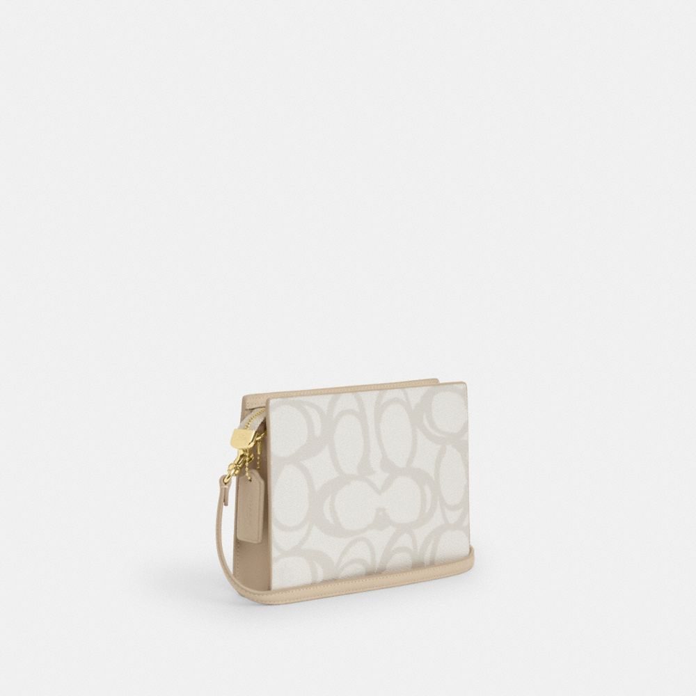 COACH®,Slim Crossbody Bag In Sketch Signature Canvas,,Angle View