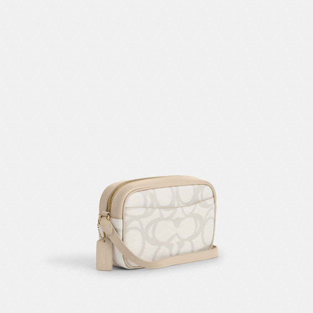 COACH®,Mini Jamie Camera Bag In Sketch Signature Canvas,,Angle View