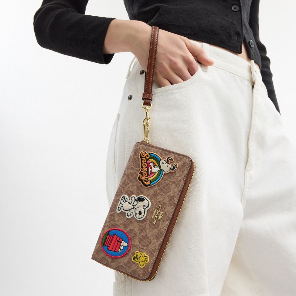 COACH®,Coach X Peanuts Long Zip Around Wallet In Signature Canvas With Patches,,Detail View