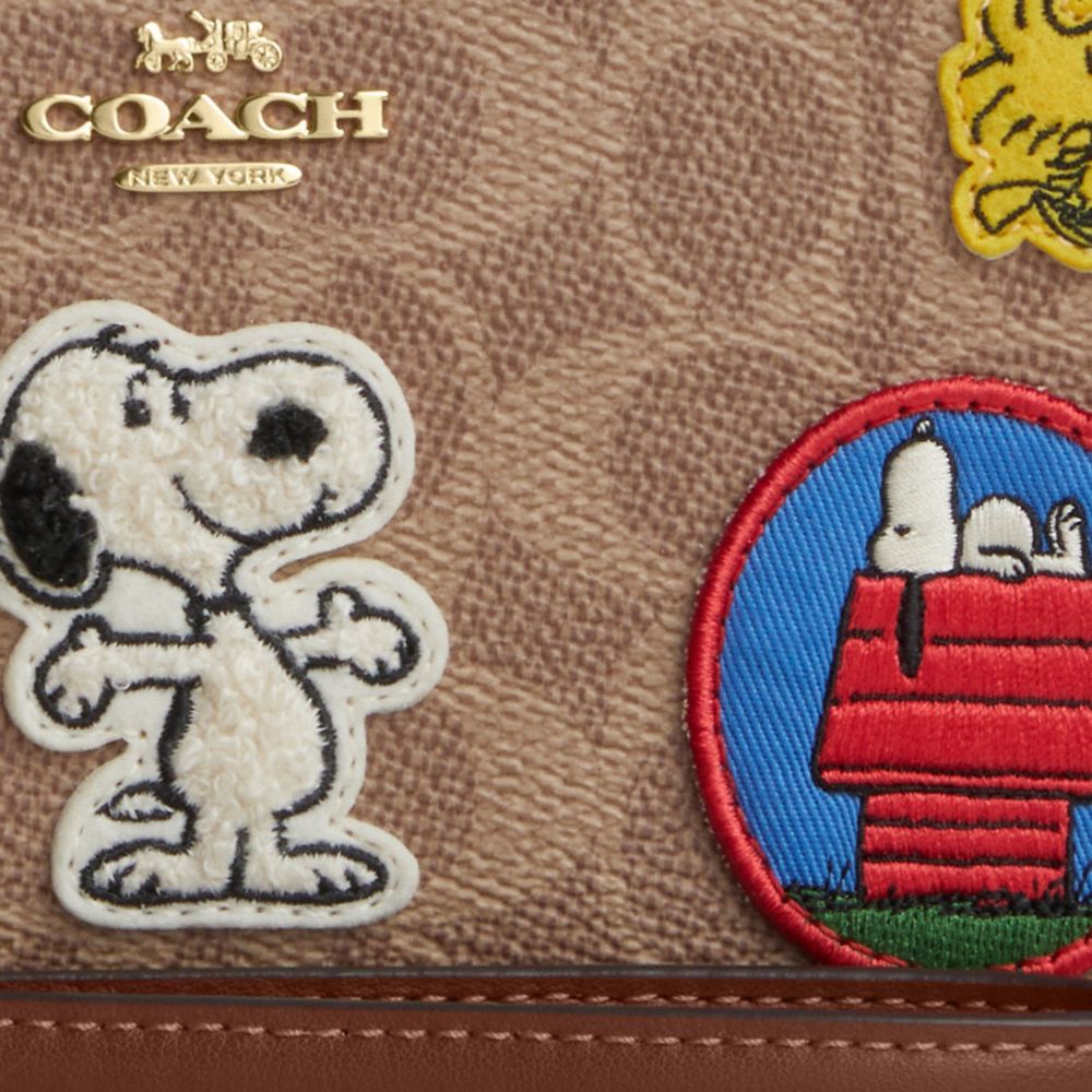COACH®,Coach X Peanuts Long Zip Around Wallet In Signature Canvas With Patches,,Closer View