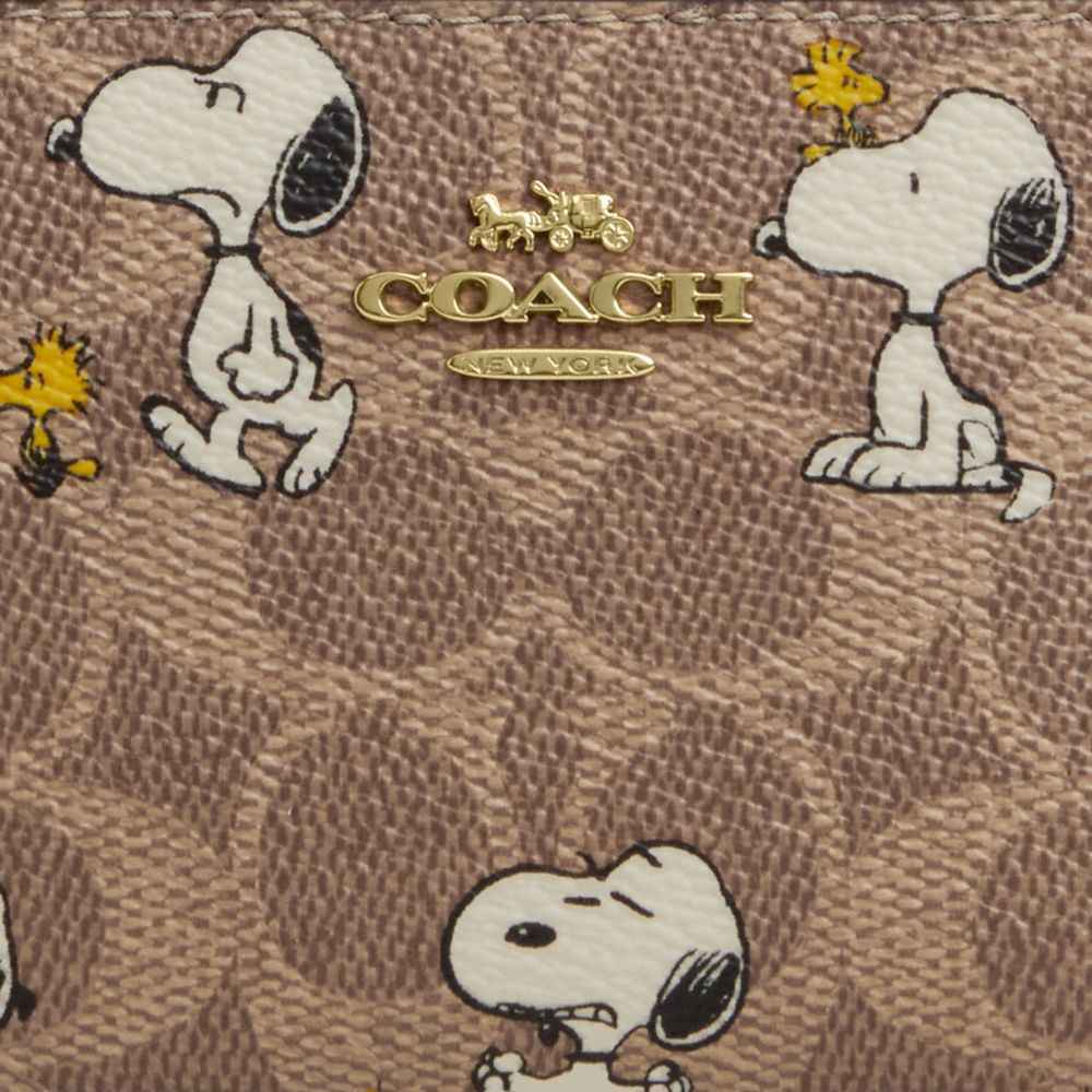 COACH®,Coach X Peanuts Snap Wallet In Signature Canvas With Snoopy Print,,Closer View