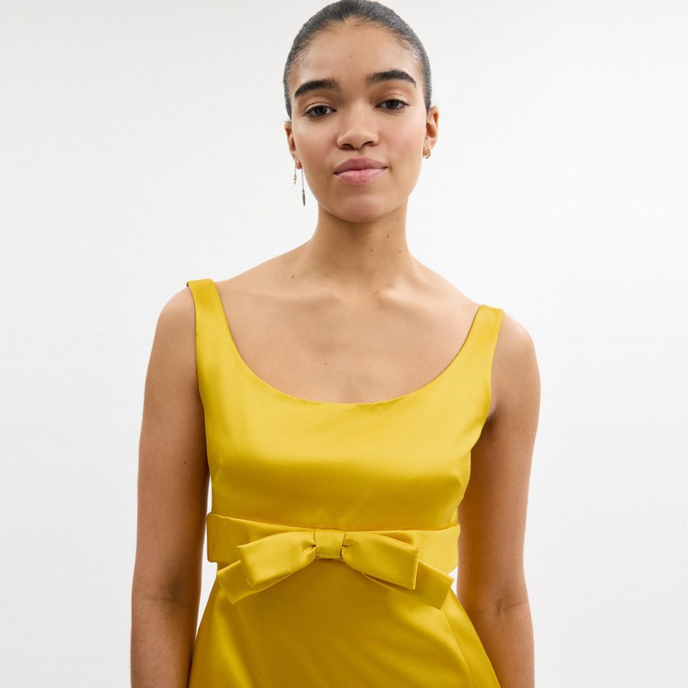 COACH®,Satin Mini Bow Dress,Mustard,Detail View