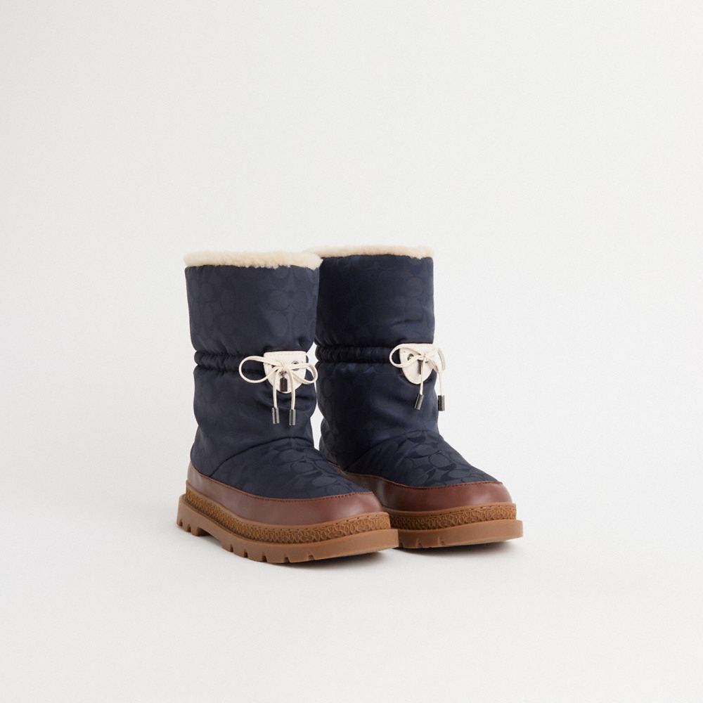 COACH®,Restored Ski Boot,Polyester,Nylon,Leather,Shearling,Rubber,Winter,Drawstring,Color Block,Cushioned,Traction,Sustain...,Navy,Angle View