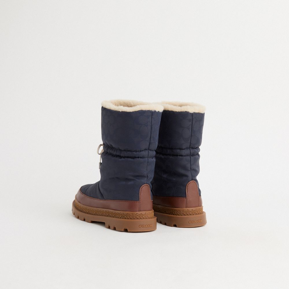 COACH®,Restored Ski Boot,Polyester,Nylon,Leather,Shearling,Rubber,Winter,Drawstring,Color Block,Cushioned,Traction,Sustain...,Navy,Back View