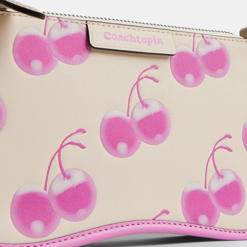 COACH®,Coachtopia | The Summer I Turned Pretty™ Small Wavy Shoulder Bag In Smooth Coachtopia Leather With Cherry Print,,Closer View