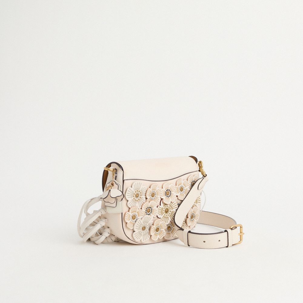 COACH®,Upcrafted Harley Crossbody Bag,Saddle Bag,Metal,Applique,Studded,Fringe,Logo,Adjustable,Brass,Day Party,Cream,Angle View