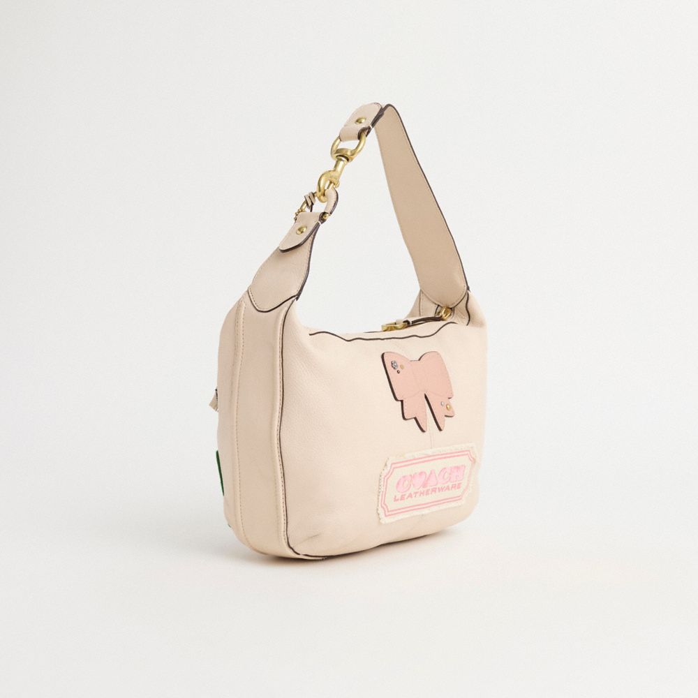 COACH®,Upcrafted Avery Small Hobo,Leather,Shoulder Bag,Applique,Tassel,Metal,Rhinestones,Logo,Studded,Shearling,Sustainabl...,Cream,Angle View