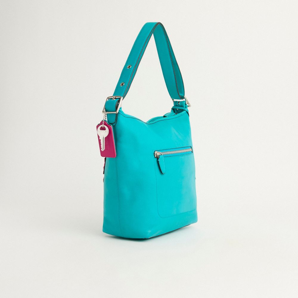 COACH®,Upcrafted Legacy Leather Duffle,Leather,Shoulder Bag,Applique,Shearling,Metal,Tassel,Logo,Silver Metal,Casual,Turquoise,Angle View
