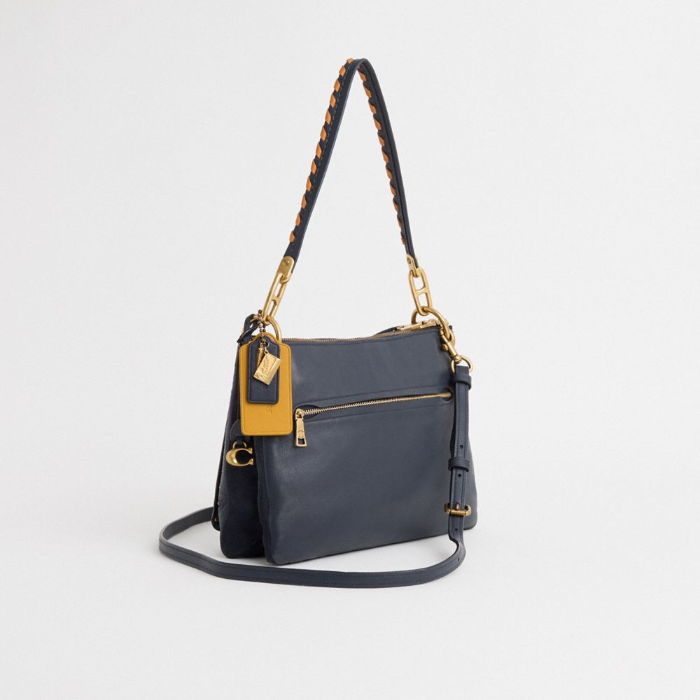 COACH®,Upcrafted Dreamer Shoulder Bag With Rivets,Suede,Leather,Shoulder Bag,Whipstitch,Logo,Studded,Metal,Brass,Casual,Navy,Angle View