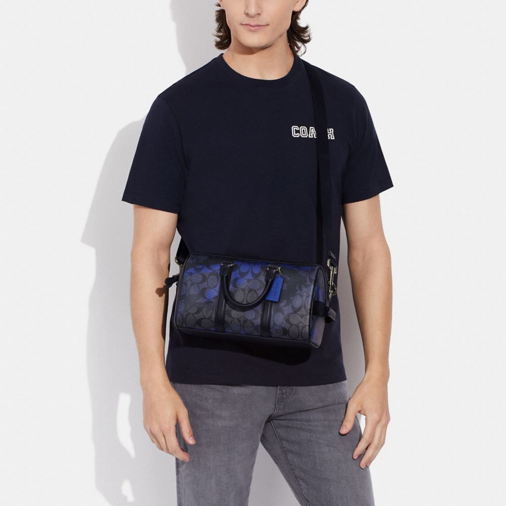 Venturer Crossbody In Signature Canvas With Camo Print
