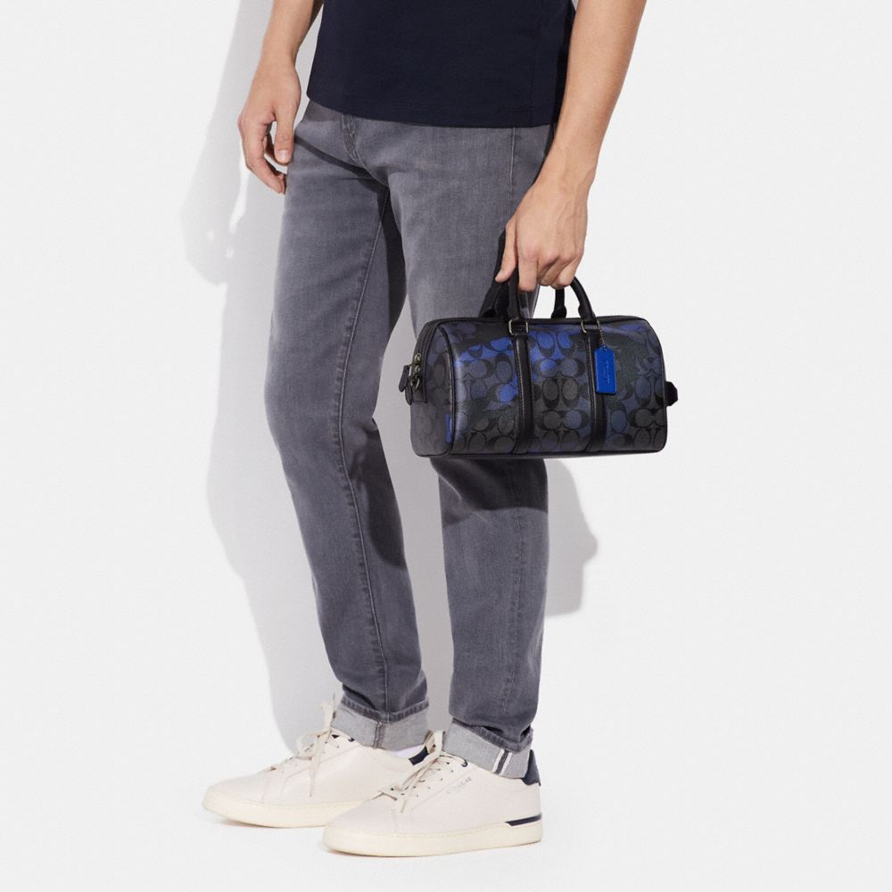 Venturer Crossbody In Signature Canvas With Camo Print