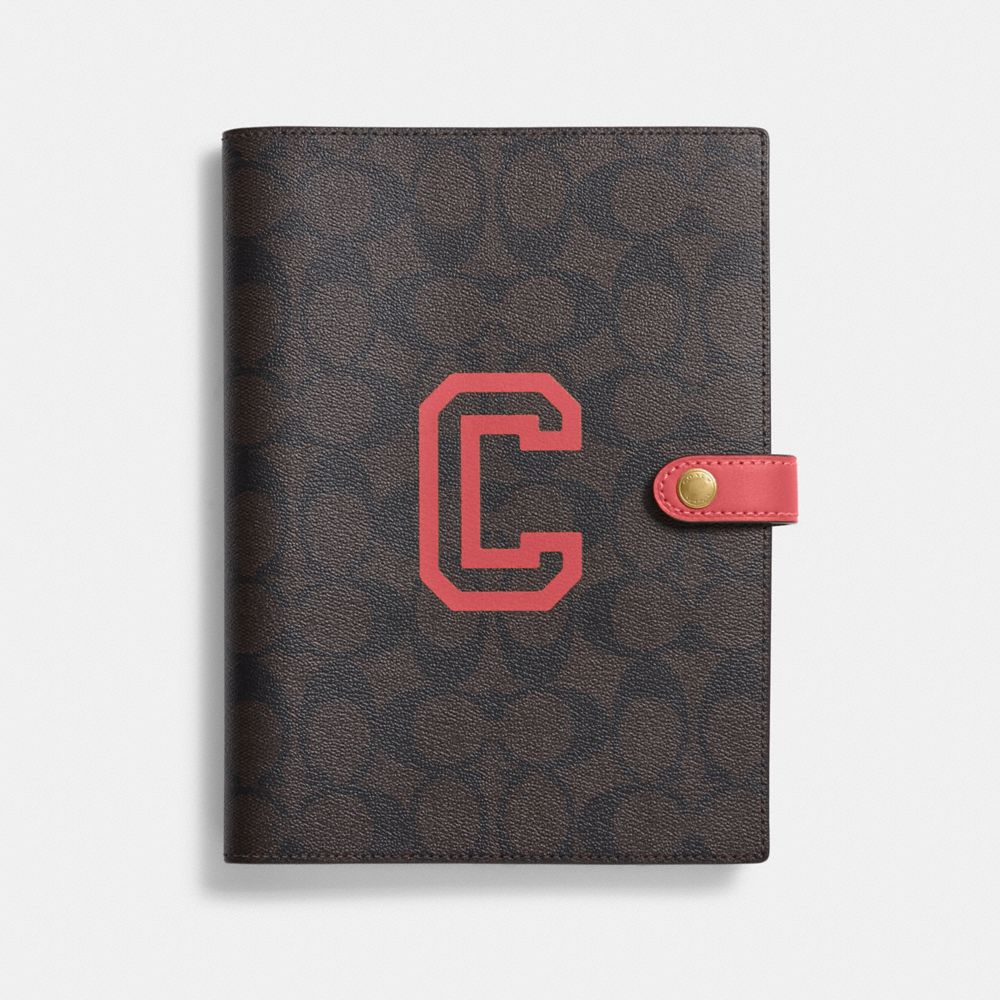 COACH®,NOTEBOOK IN SIGNATURE CANVAS WITH VARSITY MOTIF,Im/Brown Watermelon,Front View