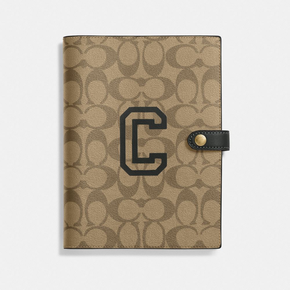 COACH®,NOTEBOOK IN SIGNATURE CANVAS WITH VARSITY MOTIF,Im/Khaki Amazon Green Multi,Front View