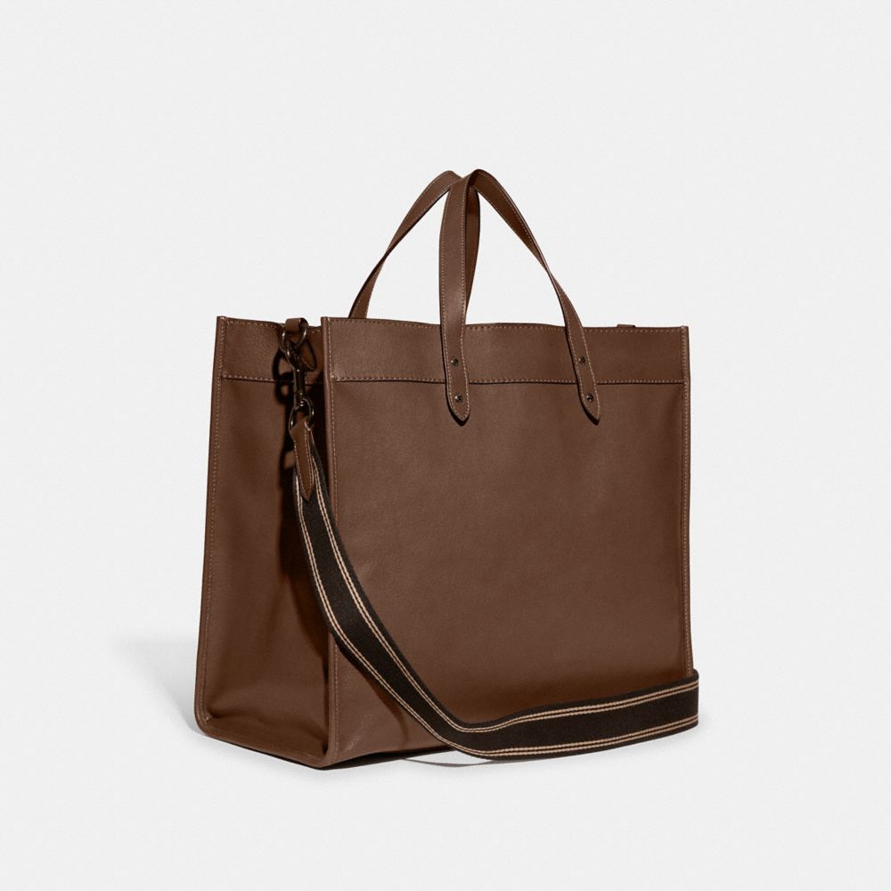 COACH®,FIELD TOTE BAG 40 WITH COACH BADGE,Smooth Leather,X-Large,Dark Saddle,Angle View