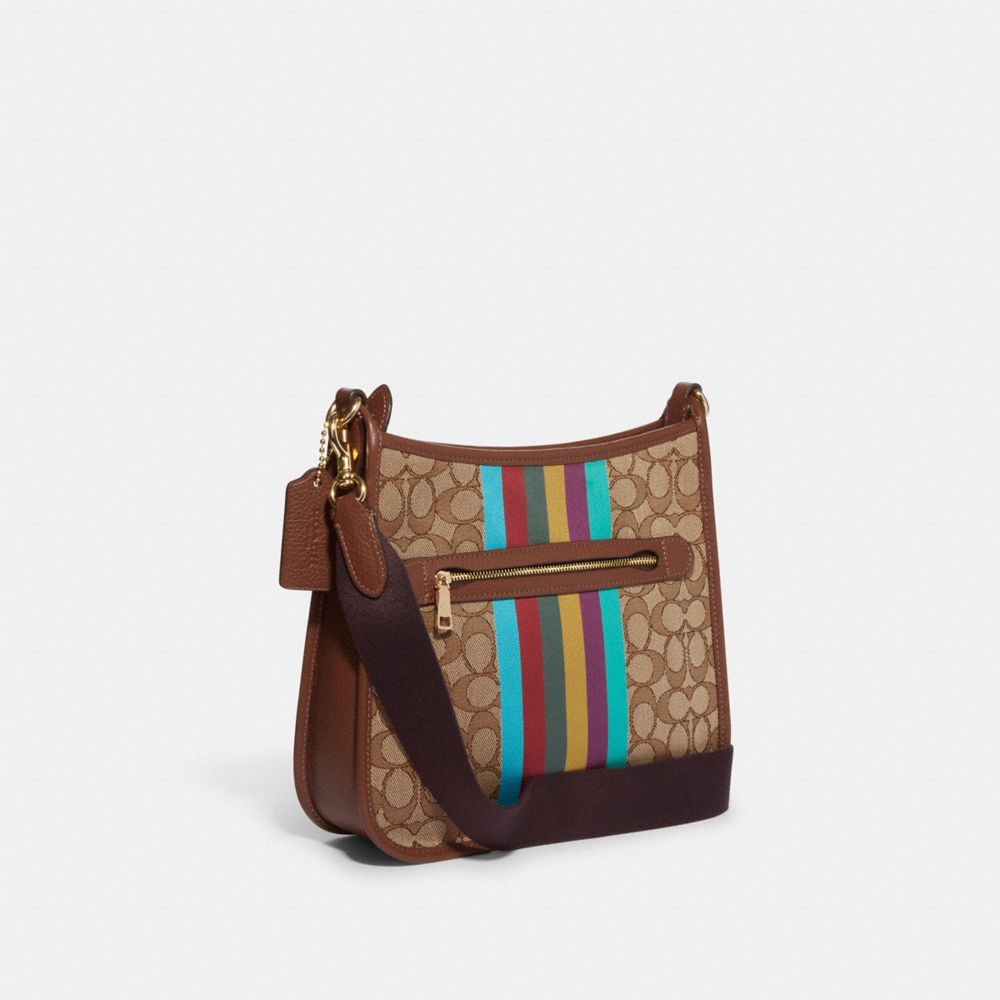 COACH®,Dempsey File Bag In Signature Jacquard With Stripe And Coach Patch,,Angle View