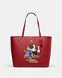 COACH®,DISNEY X COACH CITY TOTE WITH SIGNATURE CANVAS INTERIOR AND EVIL QUEEN MOTIF,Signature Coated Canvas,X-Large,Gold/Red Apple Multi/Khaki,Front View
