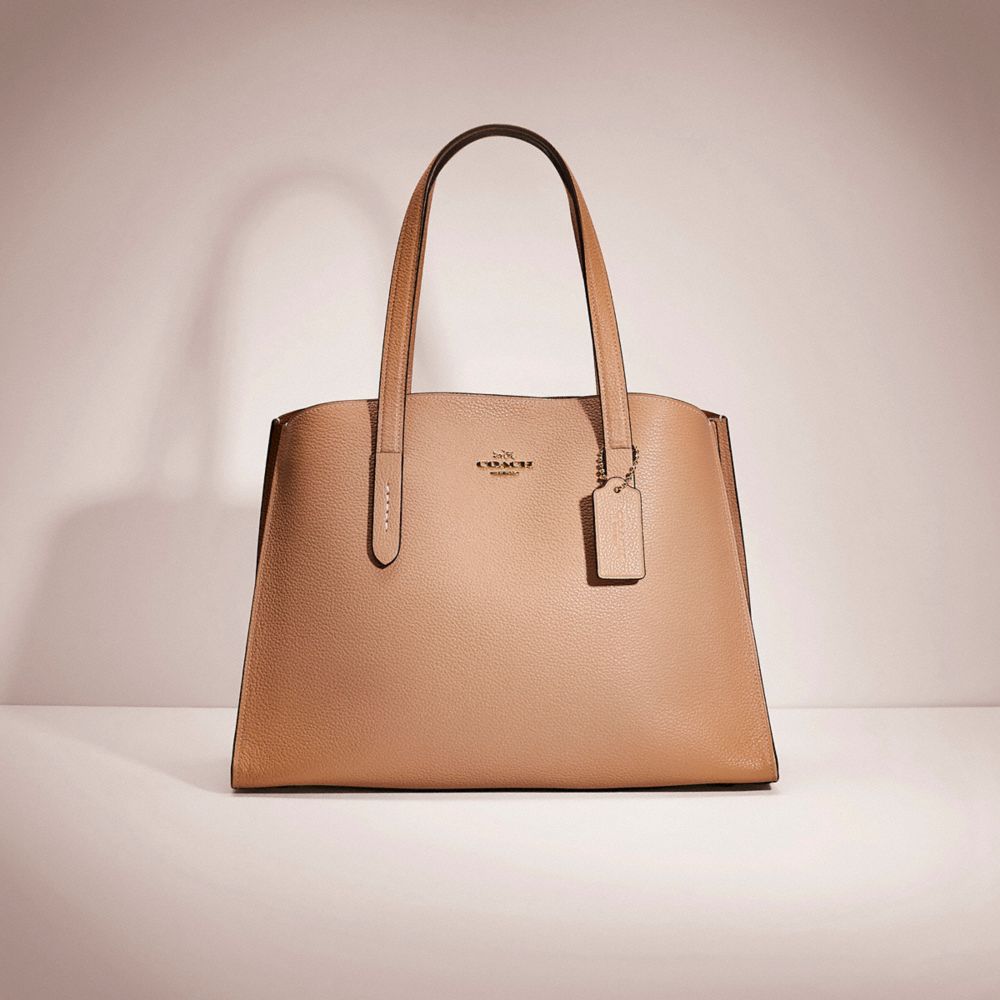 Coach purchases Charlie Carryall