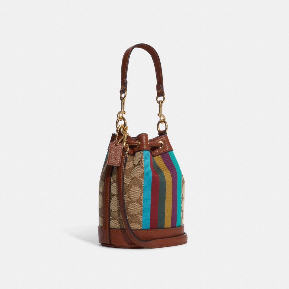 COACH®,MINI DEMPSEY BUCKET BAG IN SIGNATURE JACQUARD WITH STRIPE AND COACH PATCH,Refined Pebble Leather,Small,Gold/Khaki Multi,Angle View