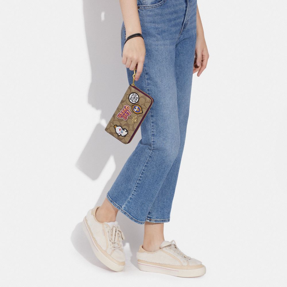 COACH x DISNEY Long Zip Around Wallet In Signature Canvas Patches