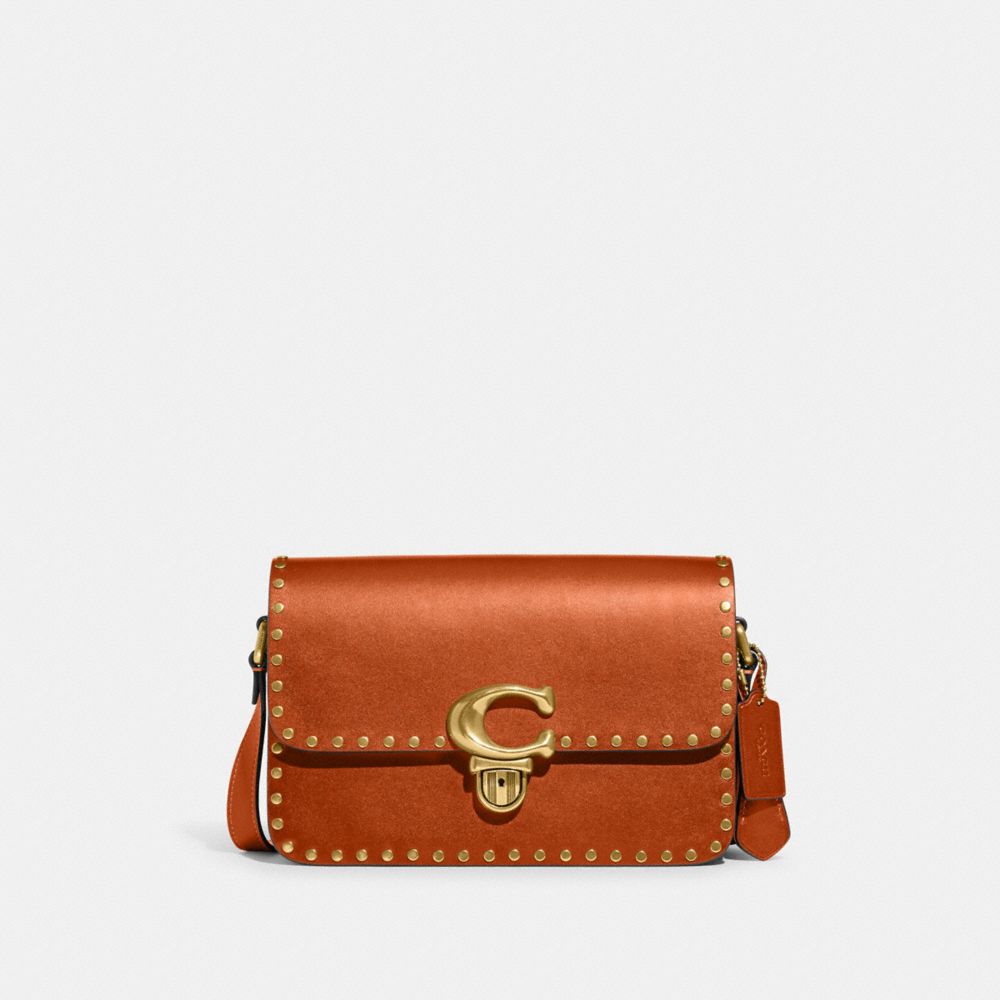 Coach bag with rivets on sale