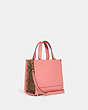 COACH®,DEMPSEY TOTE 22 WITH CREATURE PATCHES,Medium,Gold/Candy Pink Multi,Angle View