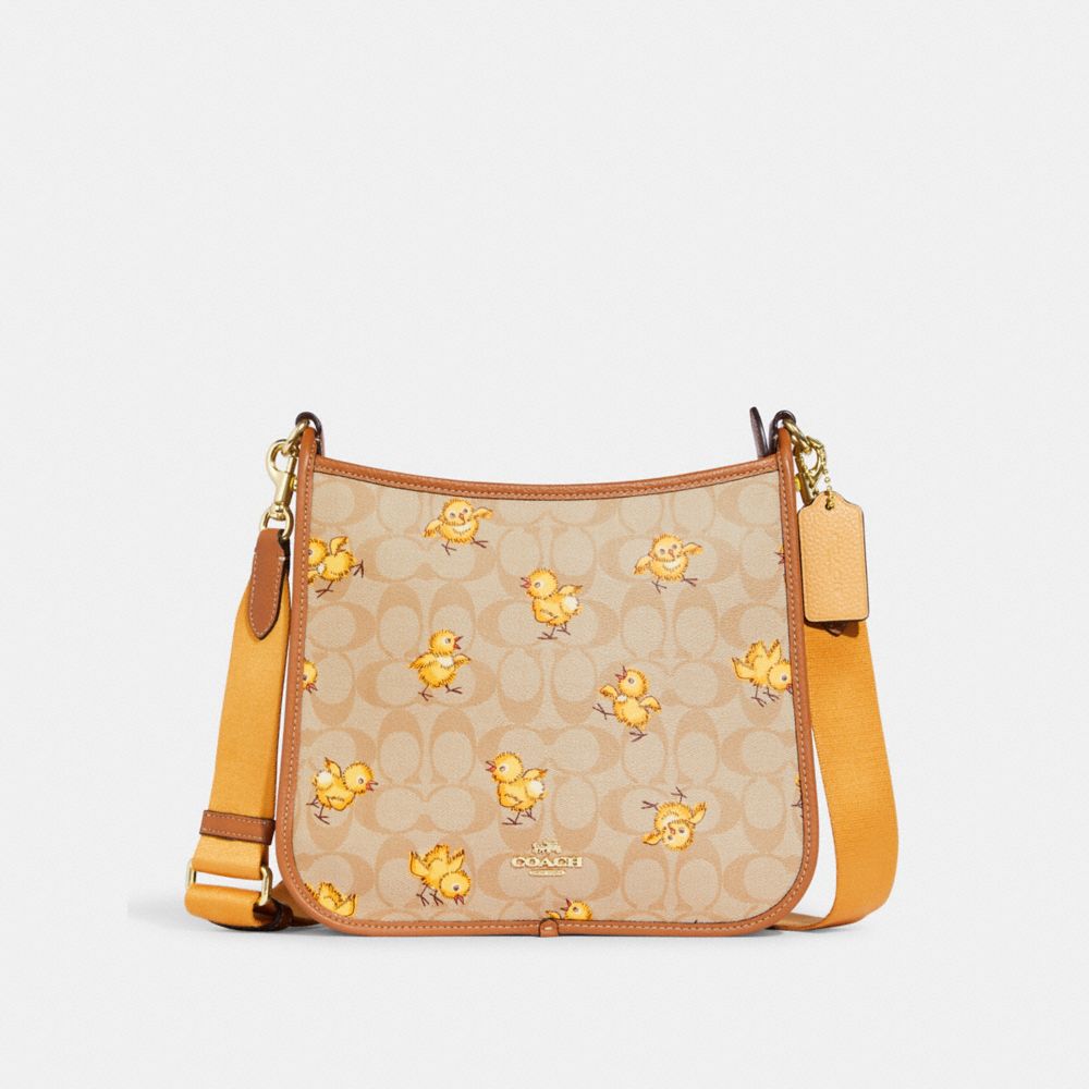 COACH®,DEMPSEY FILE BAG IN SIGNATURE CANVAS WITH TOSSED CHICK PRINT,Large,Gold/Light Khaki Multi,Front View