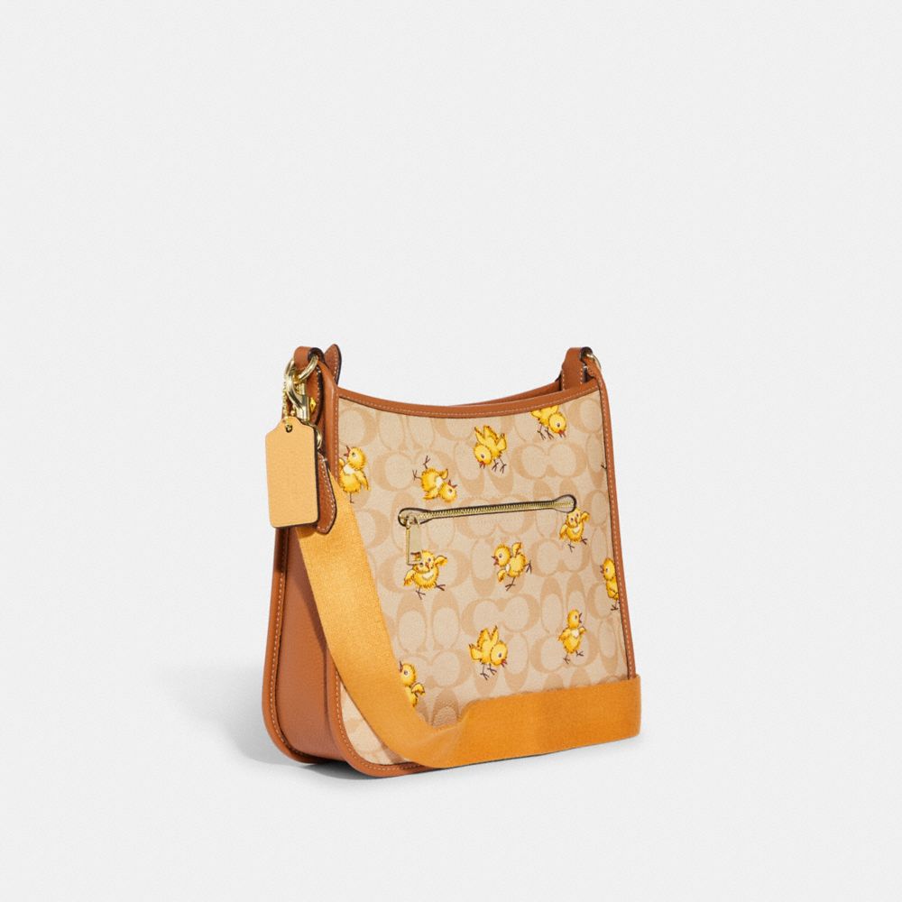 COACH®,DEMPSEY FILE BAG IN SIGNATURE CANVAS WITH TOSSED CHICK PRINT,Large,Gold/Light Khaki Multi,Angle View