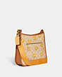 COACH®,DEMPSEY FILE BAG IN SIGNATURE CANVAS WITH TOSSED CHICK PRINT,Large,Gold/Light Khaki Multi,Angle View