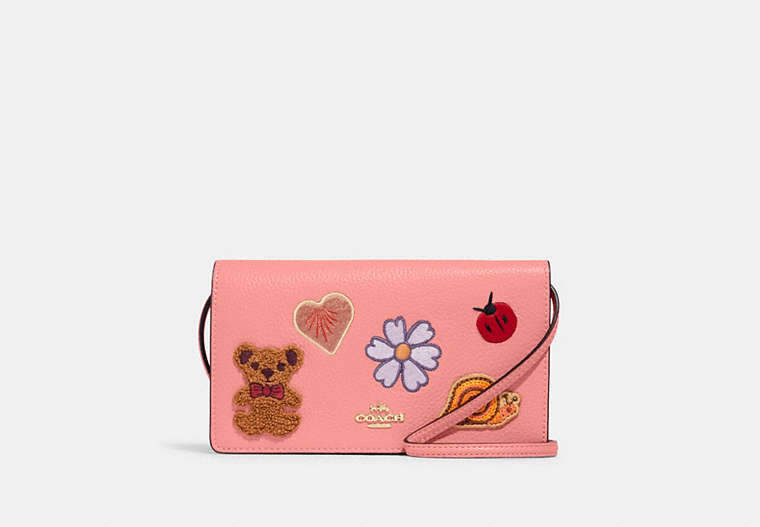 COACH®,ANNA FOLDOVER CLUTCH CROSSBODY WITH CREATURE PATCHES,Medium,Gold/Candy Pink Multi,Front View
