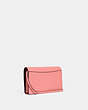 COACH®,ANNA FOLDOVER CLUTCH CROSSBODY WITH CREATURE PATCHES,Medium,Gold/Candy Pink Multi,Angle View