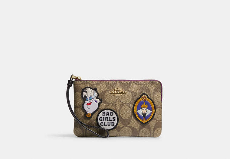COACH®,DISNEY X COACH CORNER ZIP WRISTLET IN SIGNATURE CANVAS WITH PATCHES,Signature Coated Canvas,Gold/Khaki Multi,Front View