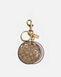 COACH®,MIRROR BAG CHARM IN SIGNATURE CANVAS WITH DANCING KITTEN PRINT,Gold/Khaki Multi,Front View