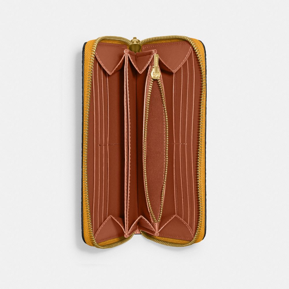 COACH®,アコーディオン ジップ ウォレット,長財布,ﾌﾞﾗｽ/ﾊﾞﾀｰｶｯﾌﾟ