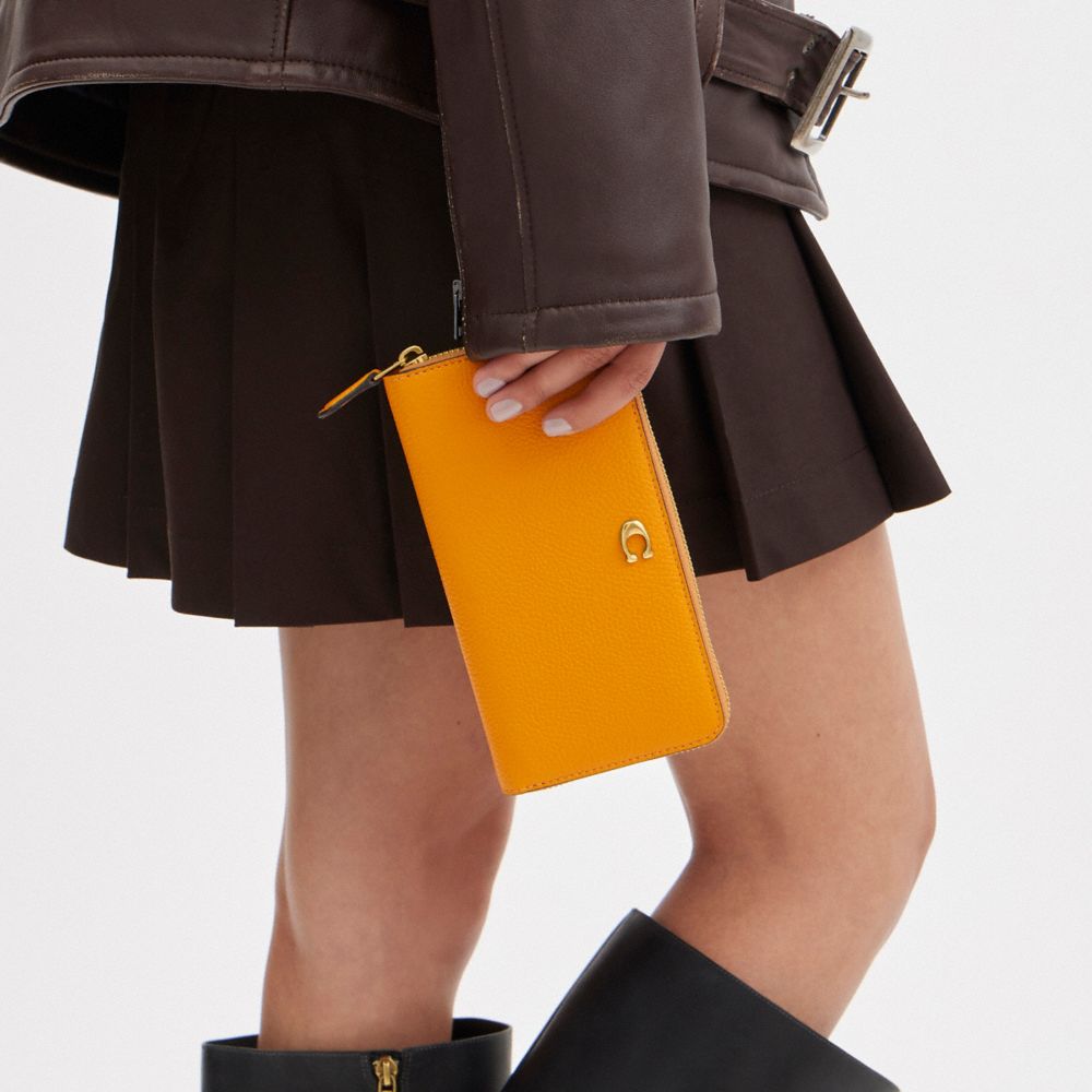 COACH®,アコーディオン ジップ ウォレット,長財布,ﾌﾞﾗｽ/ﾊﾞﾀｰｶｯﾌﾟ