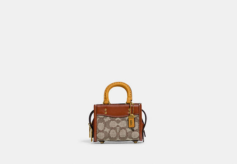 COACH®,ROGUE 12 IN SIGNATURE TEXTILE JACQUARD,Jacquard,Mini,Brass/Cocoa Burnished Amb,Front View image number 0