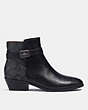 COACH®,DEAN BOOTIE,Signature Coated Canvas,Black/Black Sig C,Angle View