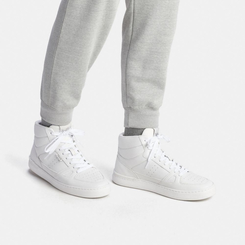 White Long Sleeved Shirt with High Top Coach Sneakers and Matching