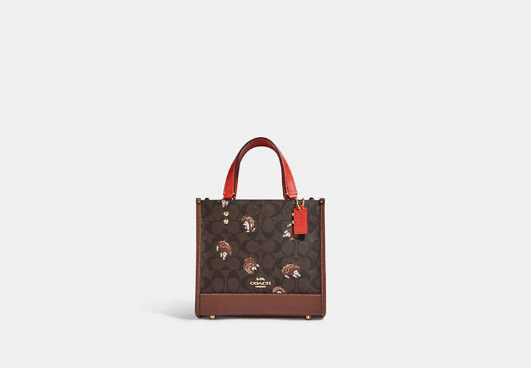 COACH®,DEMPSEY TOTE 22 IN SIGNATURE CANVAS WITH HEDGEHOG PRINT,Signature Coated Canvas,Medium,Gold/Brown Black Multi,Front View